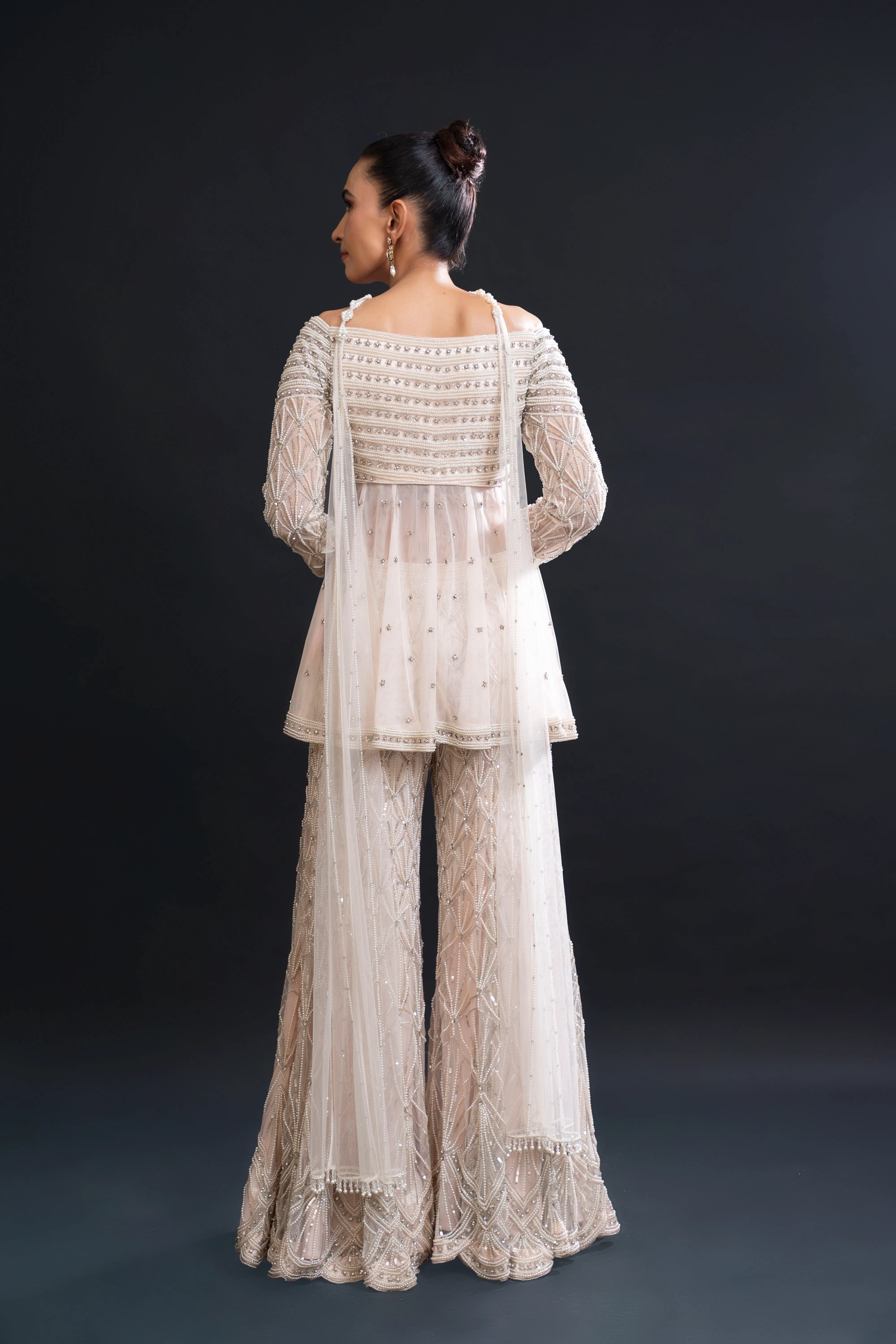 Karigar sewing detailed embroidery